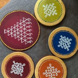 Handmade kolam art wooden coasters inspired by Indian tradition